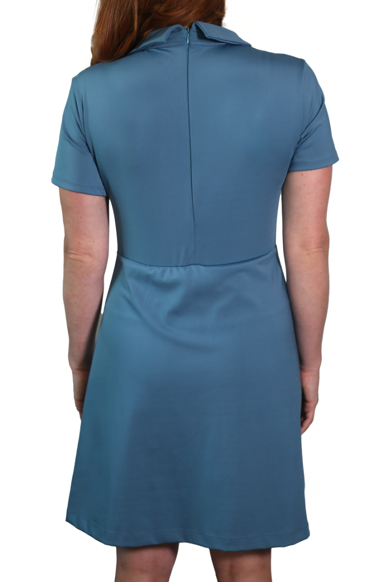 Detail shot of woman wearing Clarece Polo dress in light blue featuring back zipper and neckline.
